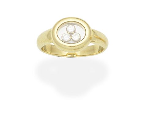 CHOPARD: 'HAPPY DIAMONDS' RINGThe glazed oval compartment revealing three 'floating' brilliant-cut diamonds, signed Chopard, 