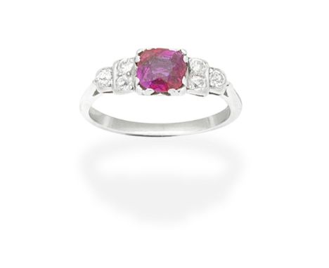 RUBY AND DIAMOND RINGThe cushion-shaped ruby between cushion-shaped diamond shoulders, ring size approx. L½Footnotes:Accompan