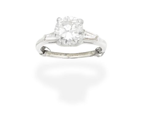 DIAMOND SINGLE-STONE RINGSet with a brilliant-cut diamond, weighing 1.99 carats, between tapered baguette-cut diamond shoulde