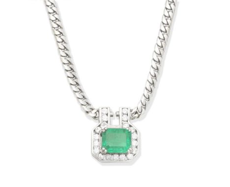 EMERALD AND DIAMOND NECKLACEThe step-cut emerald set within a brilliant-cut diamond surround, suspended from a curb-link chai
