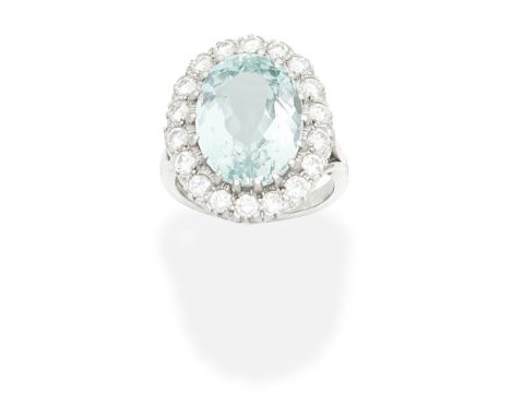 AQUAMARINE AND DIAMOND CLUSTER RINGThe oval-cut aquamarine within a brilliant-cut diamond surround, diamonds approx. 1.26cts 