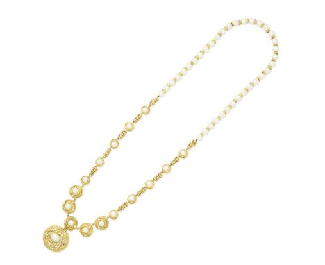 CULTURED PEARL AND DIAMOND-SET NECKLACE/BROOCH, 1990-1992Comprising a detachable 8.5mm cultured pearl necklace with gold rond