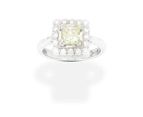 DIAMOND RING, 1998Set with a princess-cut diamond of yellow tint, within a brilliant-cut diamond surround, mounted in platinu