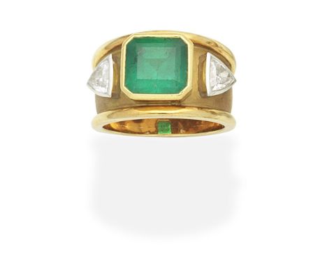 EMERALD AND DIAMOND RINGThe wide tapering band set with an octagonal-cut emerald between trilliant-cut diamonds, diamonds app