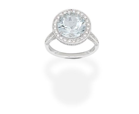 AQUAMARINE AND DIAMOND CLUSTER RINGThe circular-cut aquamarine within a brilliant-cut diamond surround, the gallery and shoul