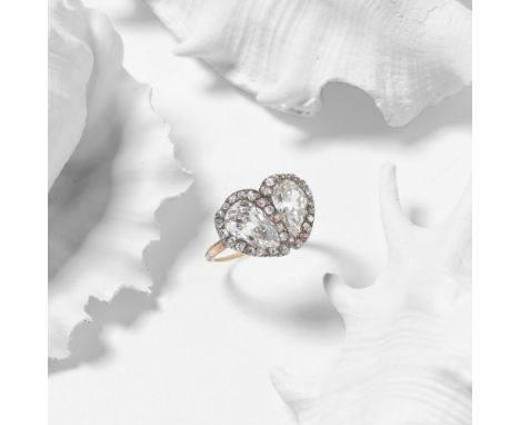 DIAMOND TWIN HEART RING, 19TH CENTURYSet with two pear-shaped diamonds each within cushion-shaped diamond surrounds, pear-sha