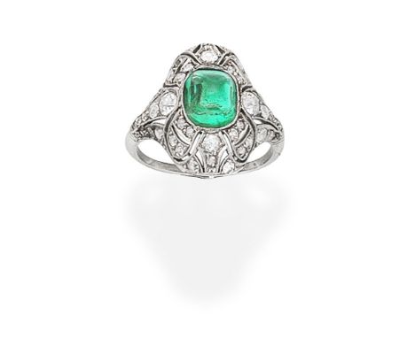 EMERALD AND DIAMOND RINGThe sugarloaf emerald within a pierced mount set with old brilliant, single and cushion-shaped diamon