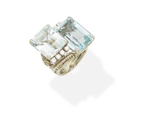 AQUAMARINE AND DIAMOND DRESS RINGSet with two step-cut aquamarines, accented by brilliant-cut diamonds, the mount of feather 
