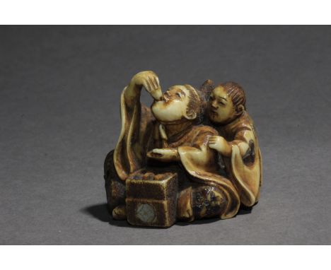 A late 19th century Japanese netsuke from Meiji period. Signed Yoshihide on a red kanji on the base. In carved elephant tusk 