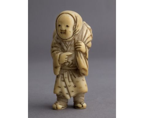 A 19th century Japanese netsuke &nbsp;from Edo period. Not signed. In carved elephant ivory portraying a woman carrying over 