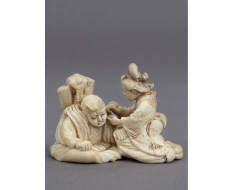 A 19th century Japanese netsuke from Meiji period. Signed Homin on the base. In carved elephant ivory portraying Raiden next 