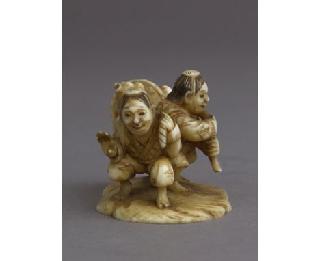 A mid 19th century Japanese netsuke. Signed Masamin or Masatami on the base. In carved ivory portraying two fishermen pulling