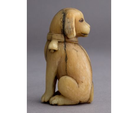 An 18th century Japanese netsuke from Edo period. Not signed. In carved elephant ivory with horn inlays portraying a standing