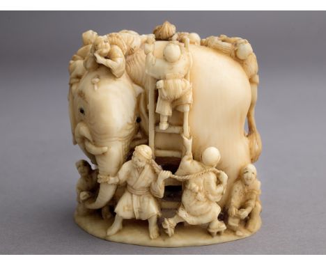 A 19th century Japanese netsuke from Meiji period. Signed Masatoshi on the base. In carved elephant ivory and horn portraying