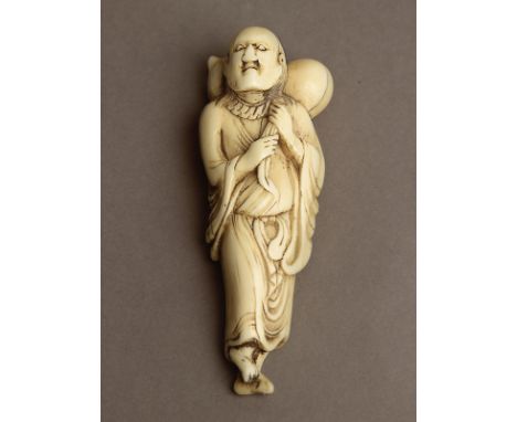 An 18th century Japanese netsuke from Edo period. Not signed. In carved elephant ivory portraying Sennin Chokaro carrying a d