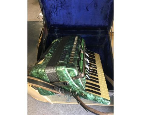 Cased Accordion in good working order, bellows are in good condition and in original case.