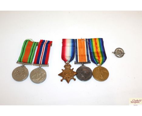 A WWI 1914 /15 Star trio to 2285 Pte. J. MC L. Watson 14-Lond R. (mounted for wear) with a "Bethune" 1914-1915 badge and two 