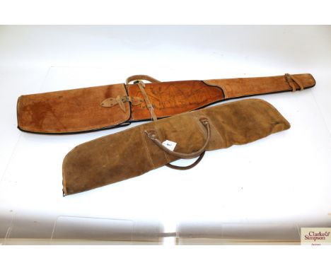 A leather suede rifle scabbard with a suede shotgun case / slip