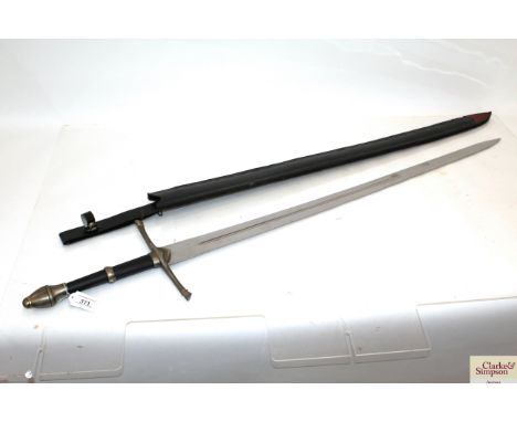 A decorative broadsword / claymore in leather scabbard