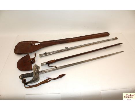 A British model 1895 Infantry officers sword with leather and steel scabbard, also includes leather sword bag and knot