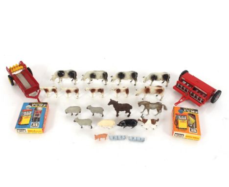 A Britains diecast muck spreader; a Britains plastic Massey Ferguson drill; two Britains make-up-model petrol pump; Britains 