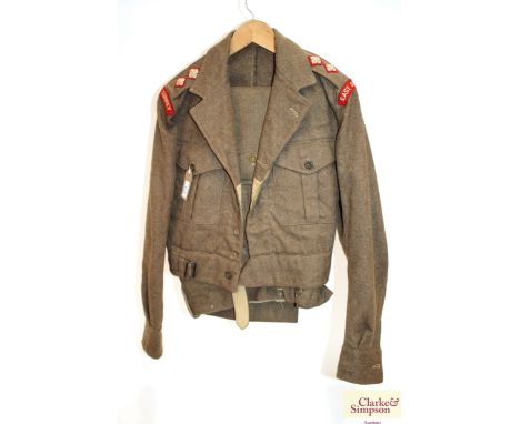 A 1949 pat battle dress blouse (size 10) to a lieutenant in the East Surrey regiment with matching trousers named to Lieutena