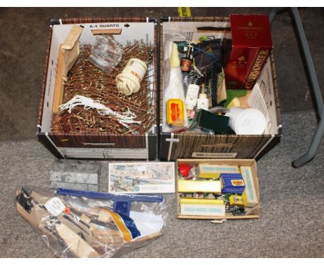 Two boxes containing model railway accessories to include fencing etc. 