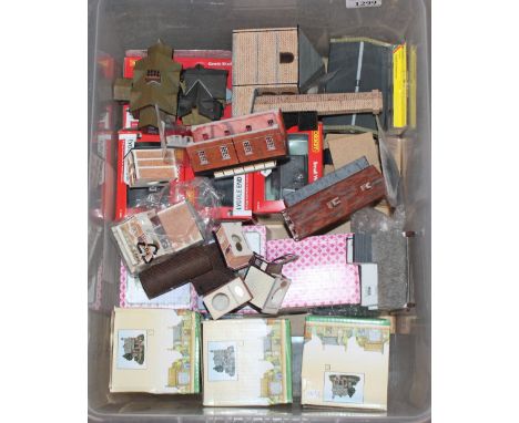 A box containing N Gauge buildings, some Hornby, model cottages etc.