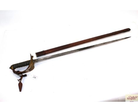 A scarce ERVII Officers sword with leather field scabbard. Blade with family crest, R.A.M.C. and ERVII engraved. This hard to