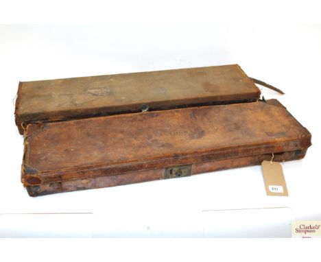 Two vintage gun cases, the canvas example with Army &amp; Navy trade label and cleaning kit present, (both AF)
