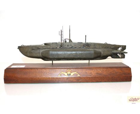 A very fine metal model of a WWII era mini submarine (Gama Xcraft) mounted on wooden plinth, which has a Royal Navy Submarine