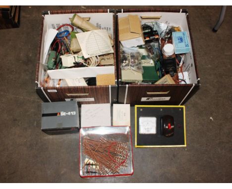 Two boxes of model railway components to include electrical fittings, telegraph poles, cabling etc.