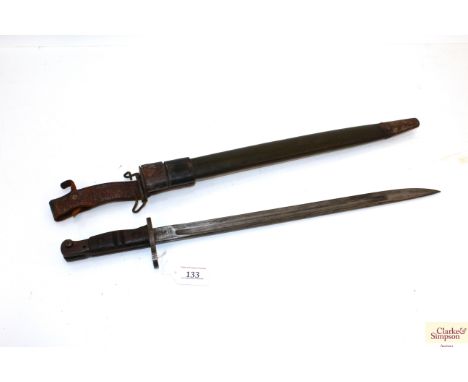 A model 1917 Enfield bayonet by Remington with scabbard and leather frog 