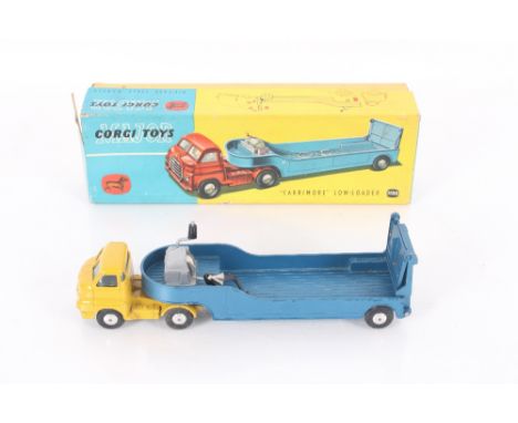 A Corgi Toys No.1100 Bedford Carrimore Low-Loader comprising yellow cab, with metallic blue low loader trailer and silver col