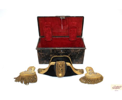 An early 20th Century Naval bicorn hat by Gieves Ltd, complete with a pair of epaulettes (Victorian buttons) and a belt buckl