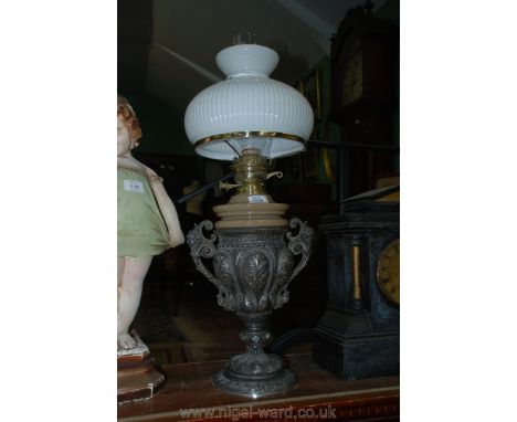 A large and heavy Oil Lamp, the base in the form of a two handled metal vase.