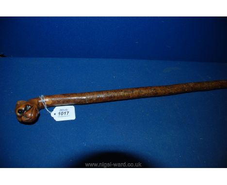 A Walking Stick with dog's head handle