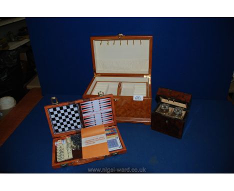 A small lidded box with two compartments, each containing glass stoppered bottle, a travelling games compendium and a modern 