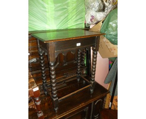 An Oak Occasional Table with rectangular top, shaped frieze on bobbin turned legs with stretchers