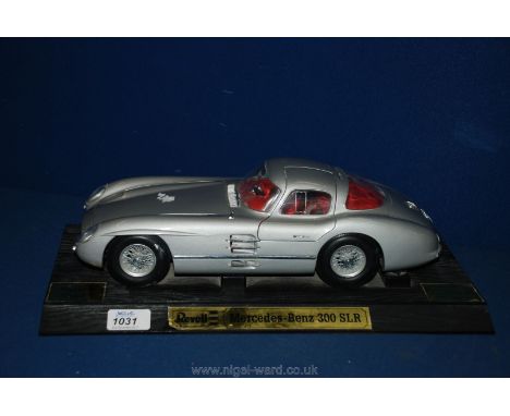 A good die-cast metal, metallic silver finished 1:12 scale Model of a gull-wing Mercedes 300SLR motor Car by Revell, "Made wi