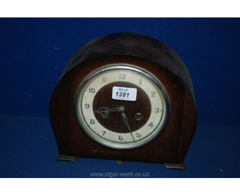 A Smiths Enfield two train movement, Oak cased Mantel Clock, having Arabic numerals and chiming on a gong. 