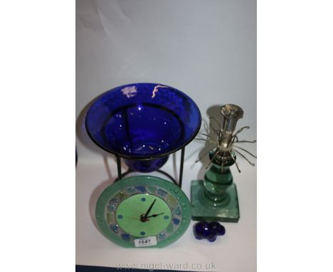 A blue glass bowl on stand, an art deco green glass and chrome candlestick and a glass clock etc.