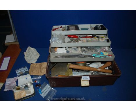 A plastic tool box with jeweler's Tools and semi-precious stones, etc