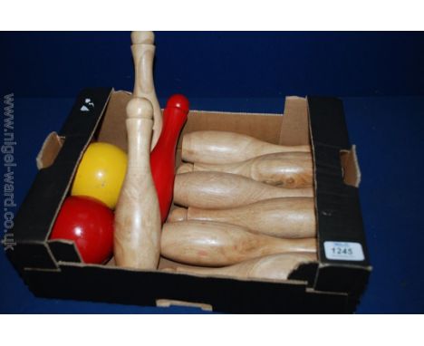 A set of nine vintage Skittles and two balls.