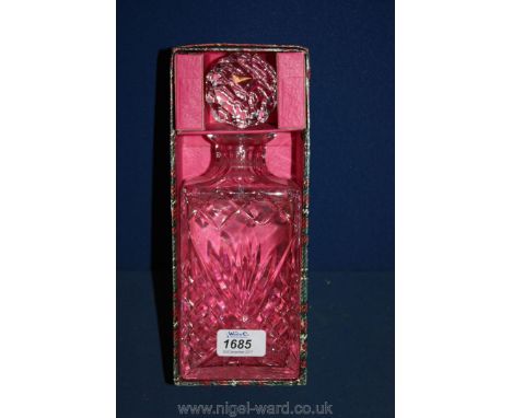 A heavy glass cut crystal Decanter in tartan box