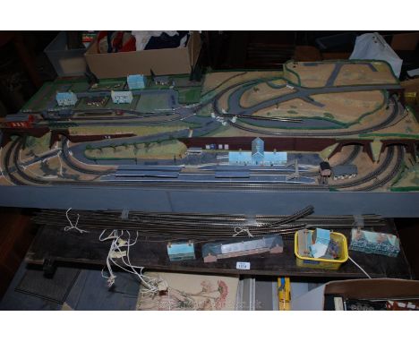 A N-gauge model Train Layout, spare track and box of controllers, accessories, spare buildings, figures, etc., 