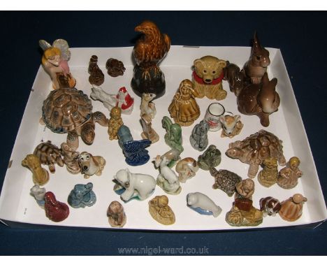 A quantity of Wade Whimsies including a polar bear, seal,Santa, Bambi, Tinkerbell, tortoises, Beneagles Scotch Whisky decante