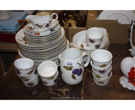 A quantity of Royal Worcester 'Evesham' tableware including dinner and salad plates, gratin dishes, jug and ramekins