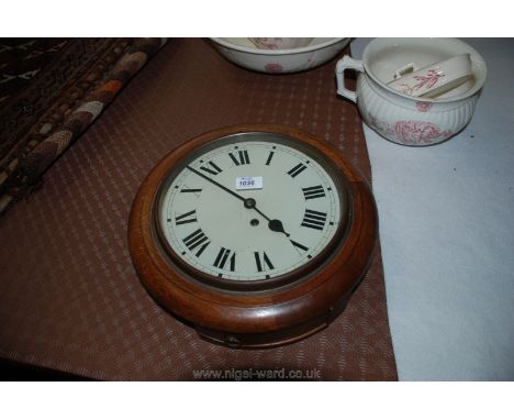 A wall mounted Clock with wooden surround
