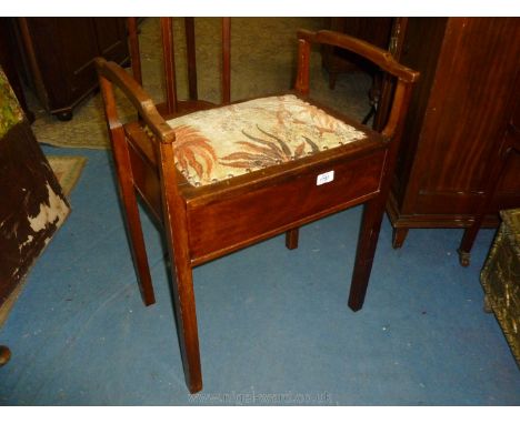 An Edwardian Mahogany Piano Stool with two slender handles, tapestry style fabric seat, on square legs